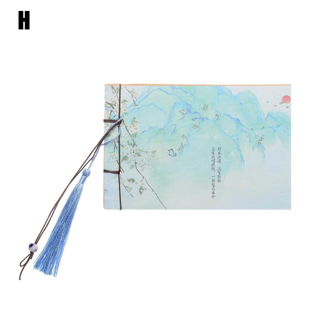 Hand-stitched kraft paper notebook with a tassel bookmark, shown in a natural colour.