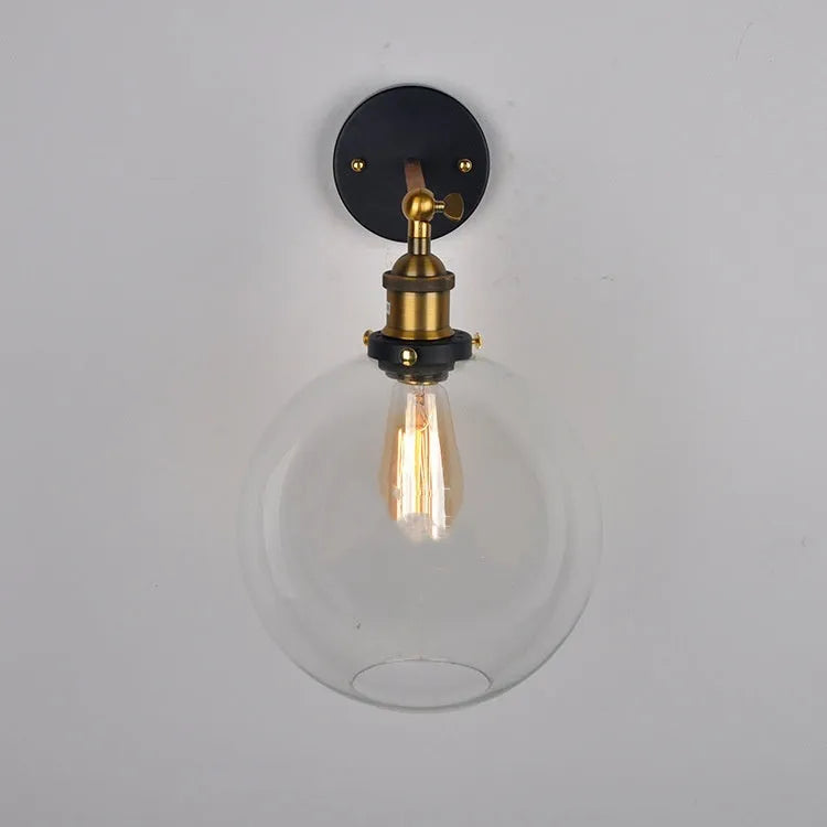 Retro spherical glass wall light fitting with a 20cm diameter, shown in amber tint.