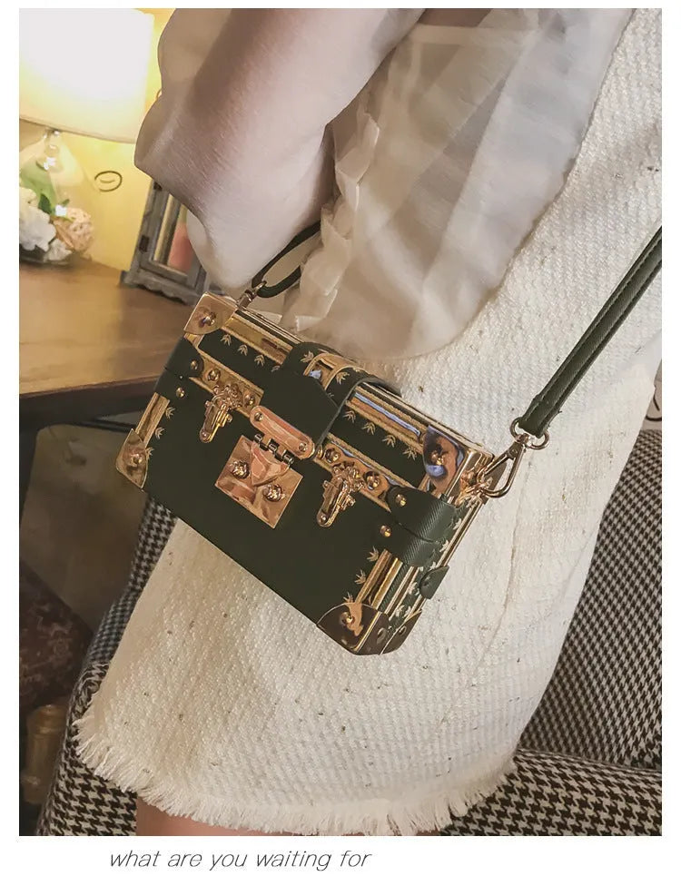 Women's structured black PU shoulder bag with flap and adjustable crossbody strap