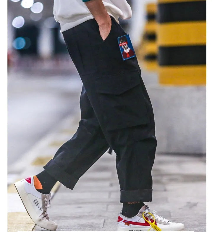 Influx men's Harajuku Hong Kong wind harem pants in black with loose straight-leg cut and waistband