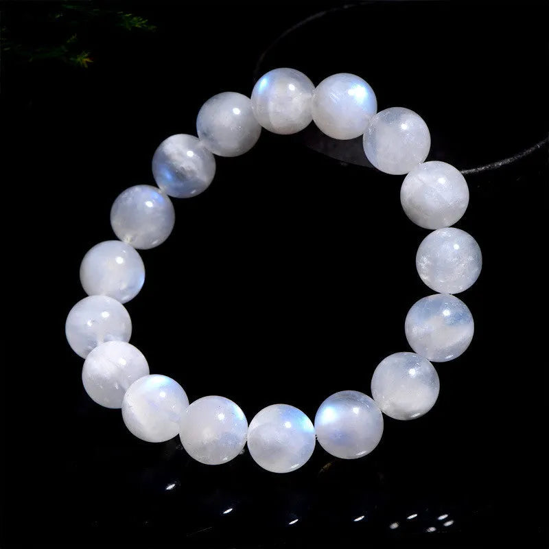 Natural white Blue Moonlight Moonstone round bead bracelet on wrist, showing polished gemstone beads.