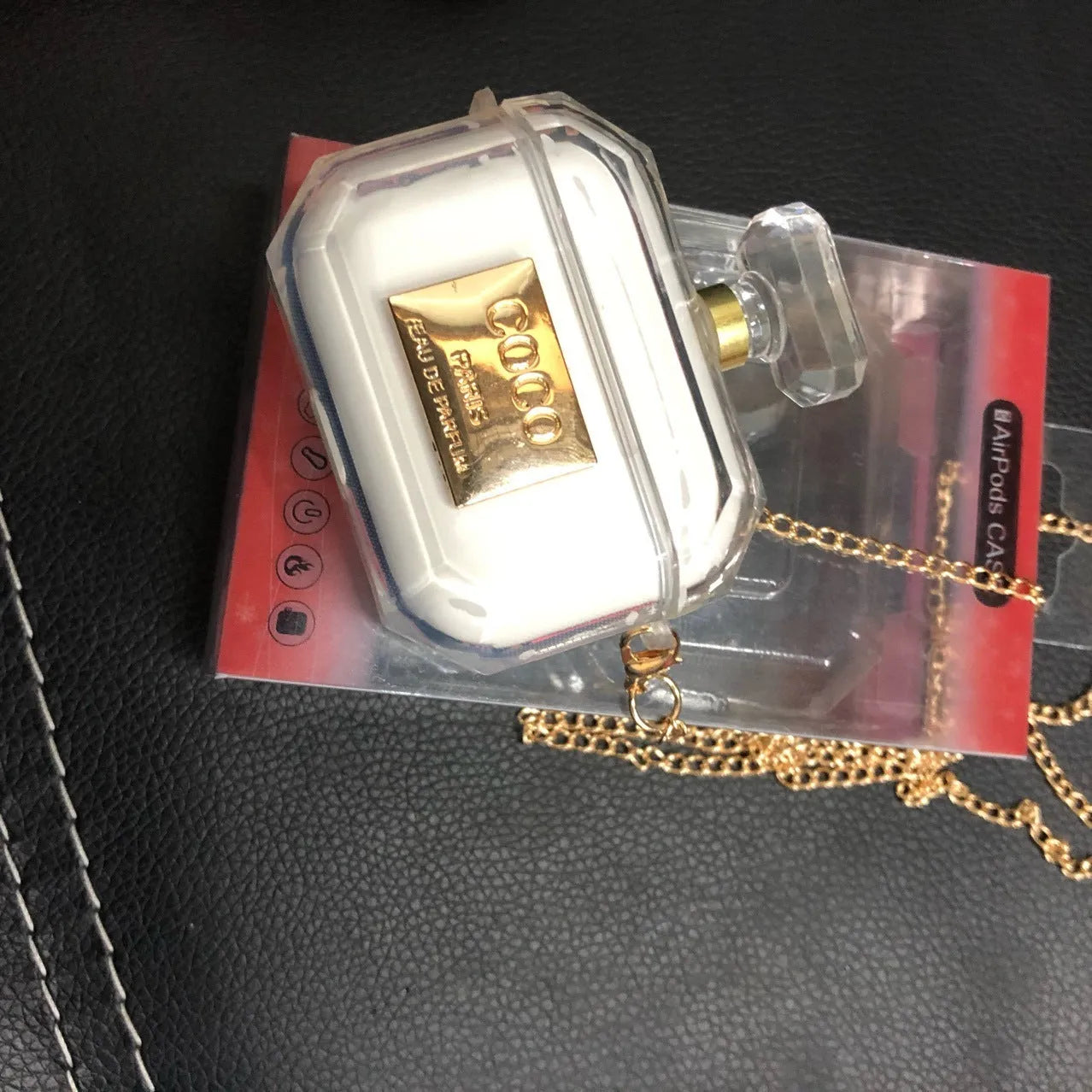 White silicone perfume bottle style case for AirPods Pro and AirPods 3 charging box.
