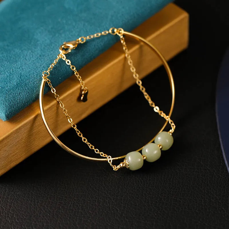 Hetian jade lucky beads bracelet with gold inlay treatment in single, double, or three beads version