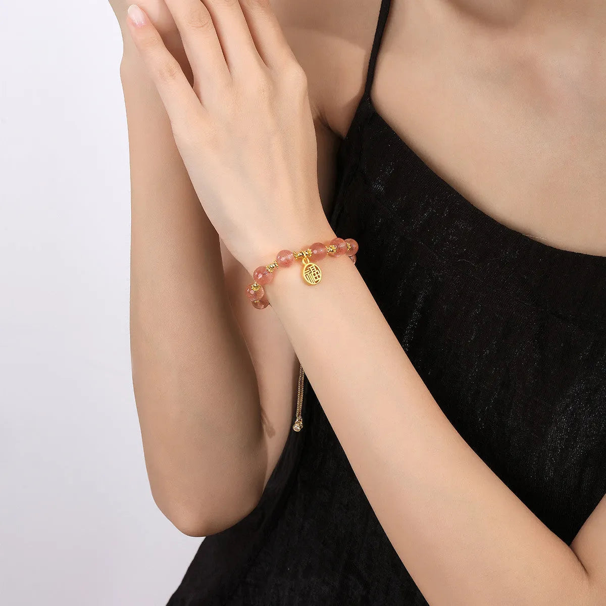 Strawberry quartz crystal bracelet with geometric fu character design and electroplated finish
