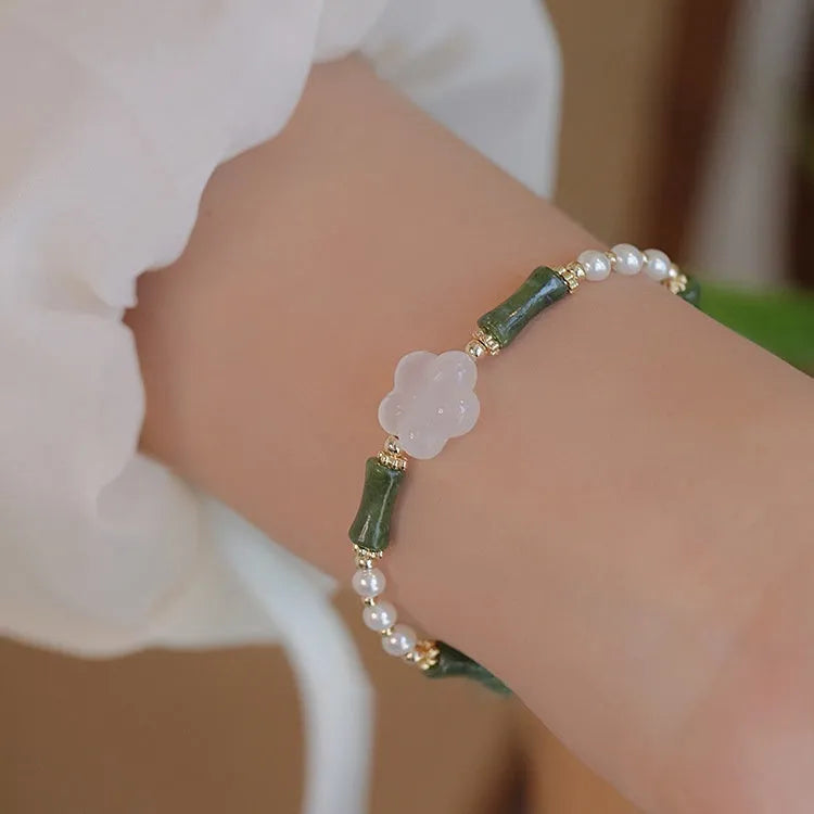 Chinese style olivine bamboo joint shell pearls bracelet with Hetian jade and copper detailing