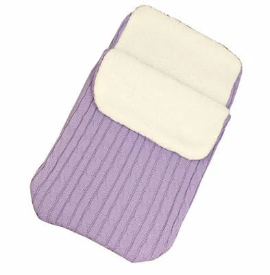 Envelope-style baby stroller sleeping bag in beige colour with thick filling, shown next to a pram.