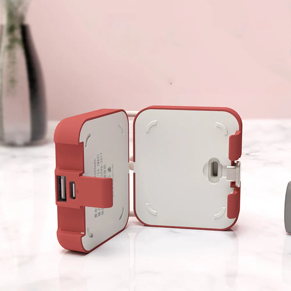 Handbag clip power bank in blue, green, red, or white with mobile phone stand functionality and dual charging ports