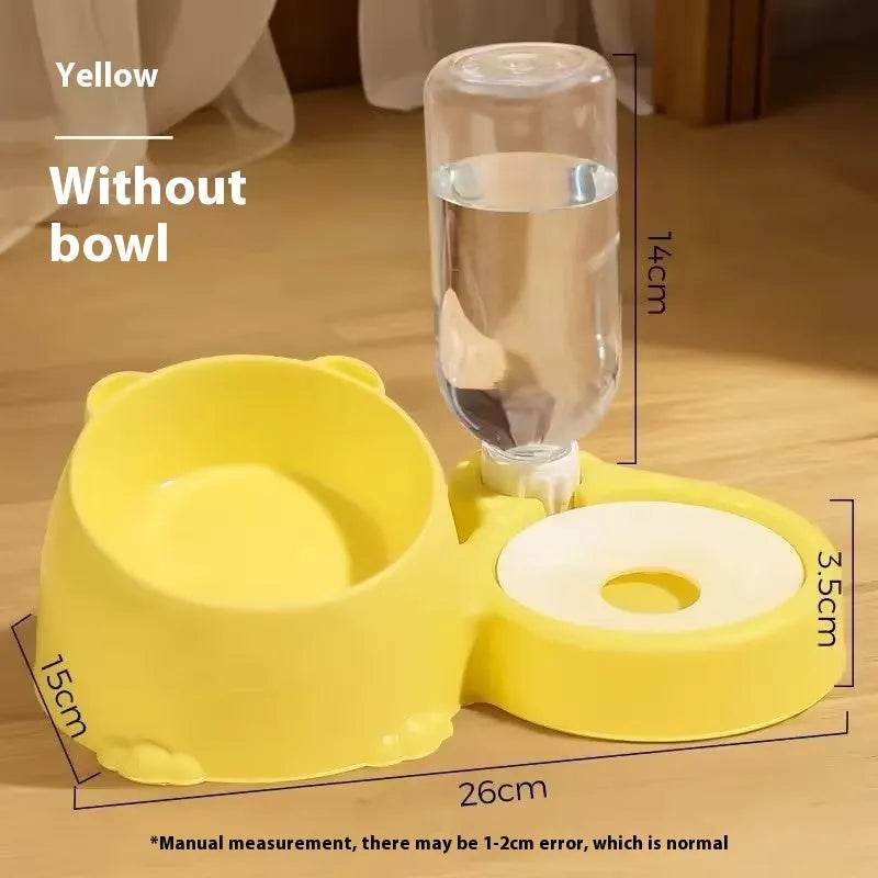Green automatic pet feeder with white ceramic food bowl and stainless steel water compartment on a stable base.