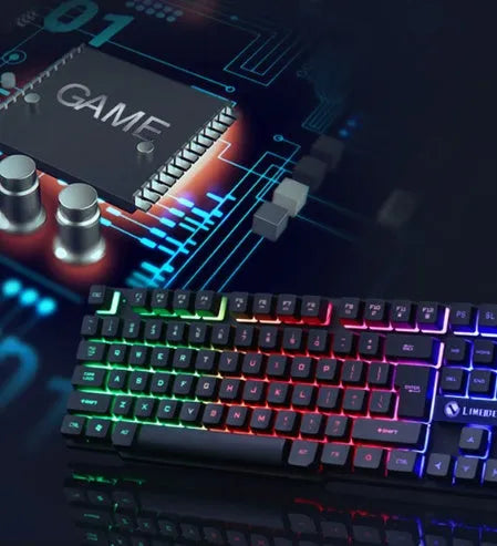 Wired gaming keyboard and mouse set with rainbow backlight and floating keys in black on a desk