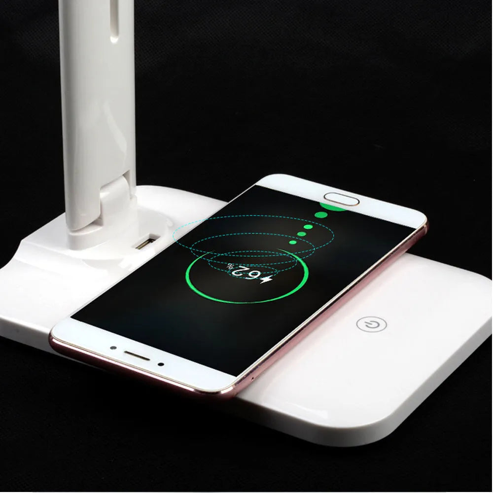 White eye protection desk lamp with wireless charging pad and touch dimmer on a desk