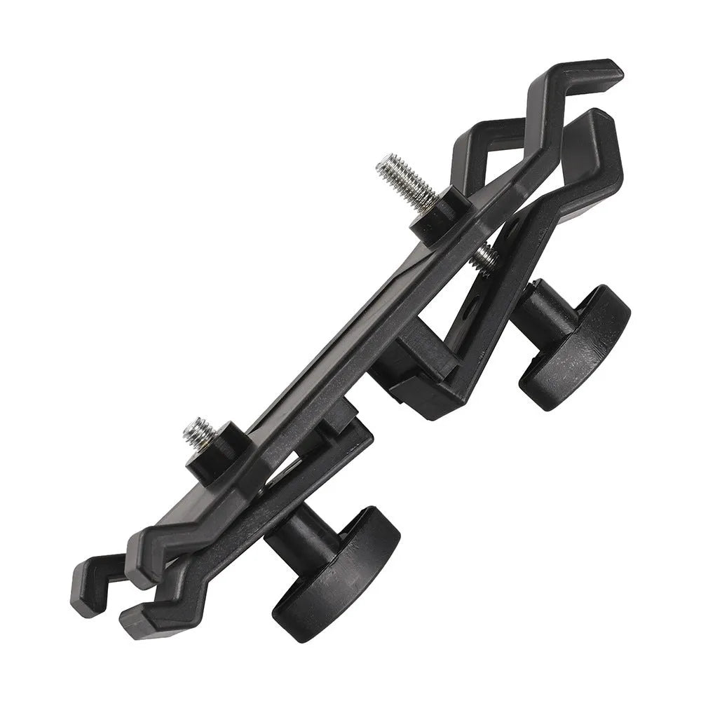 Black plastic umbrella clip attached to camera tripod holding smartphone under umbrella