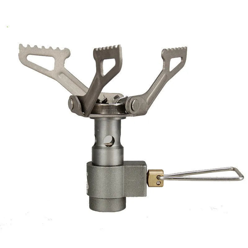 Compact portable gas camping stove with one-piece cast iron burner on a green background.