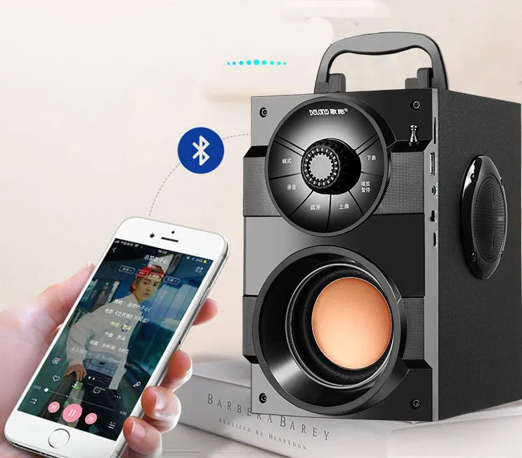 Compact black portable audio system with subwoofer, connection cable, and USB power input.