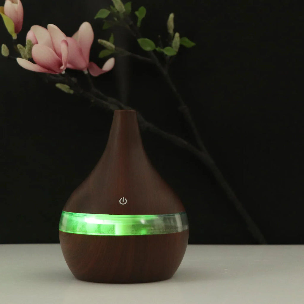 Columnar USB mini air purifier and humidifier in wood grain finish on a desk