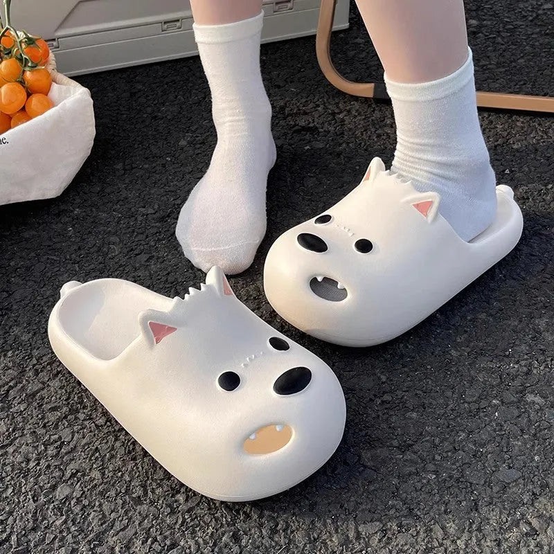 Women's black EVA slipper sandals with puppy toe cap design showing injection-moulded sole