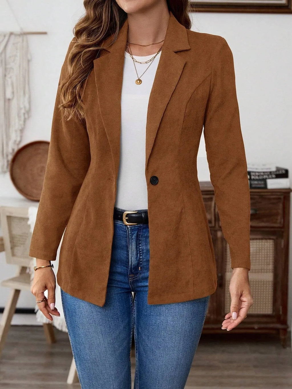 Brown men's single-breasted lapel leisure suit coat on a hanger.