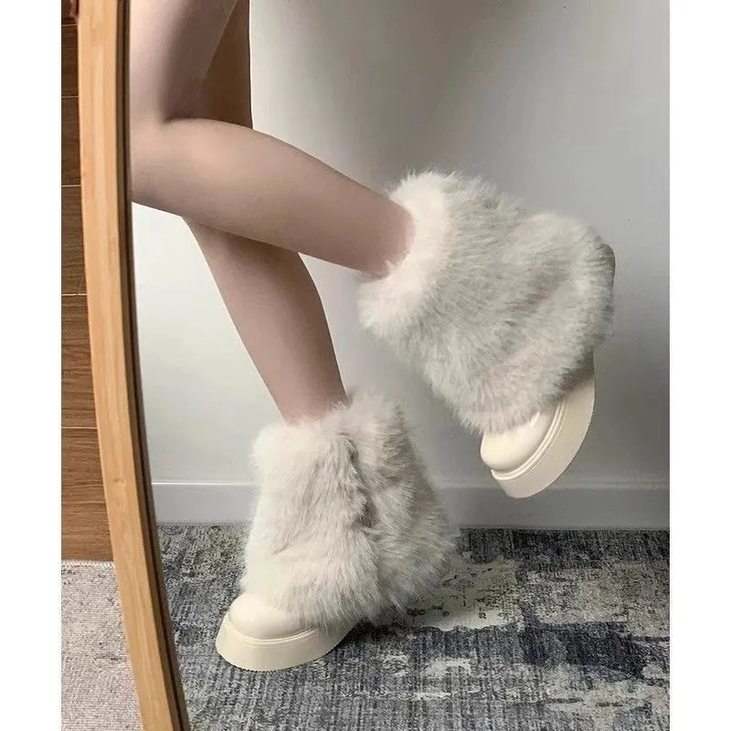 Women's black artificial plush snow boots with a waterproof rubber sole and round toe design.