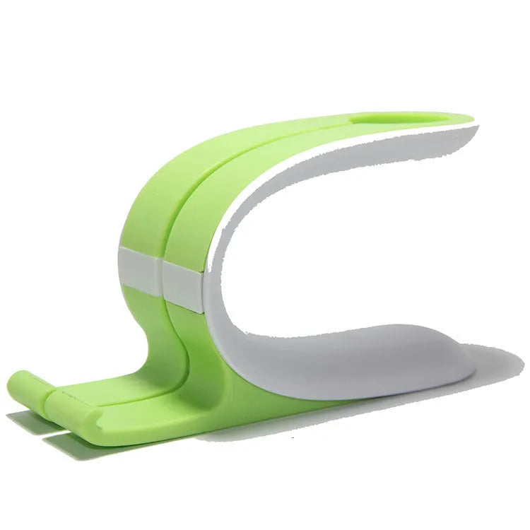 Grey and green Apple iPhone and Apple Watch charging stand on desktop