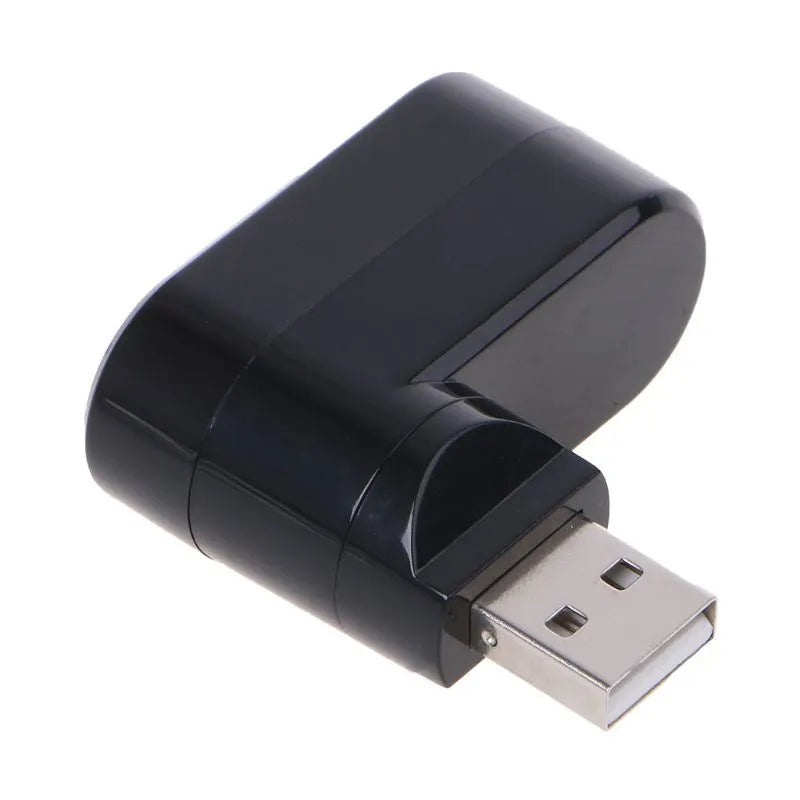 Black or white USB 2.0 four-port hub for laptop expansion on a desk.