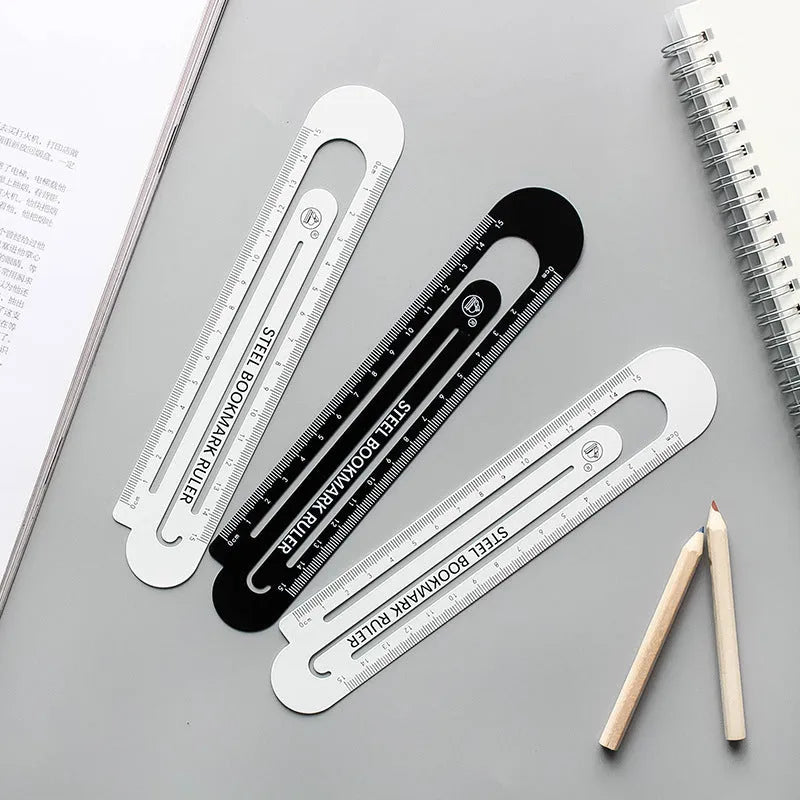 Black and white two-sided metal ruler showing 12 cm length scale.