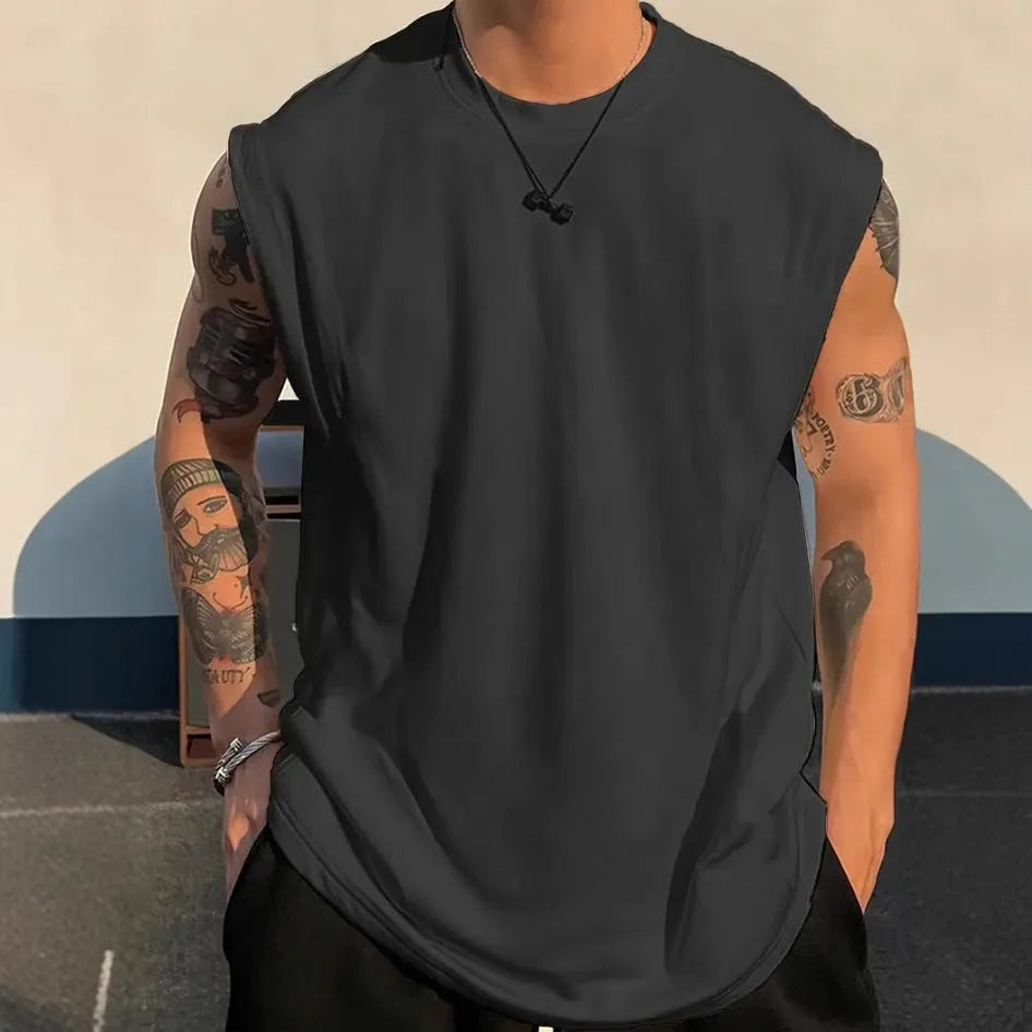 Men's loose sleeveless cotton tank top in a solid colour on a hanger