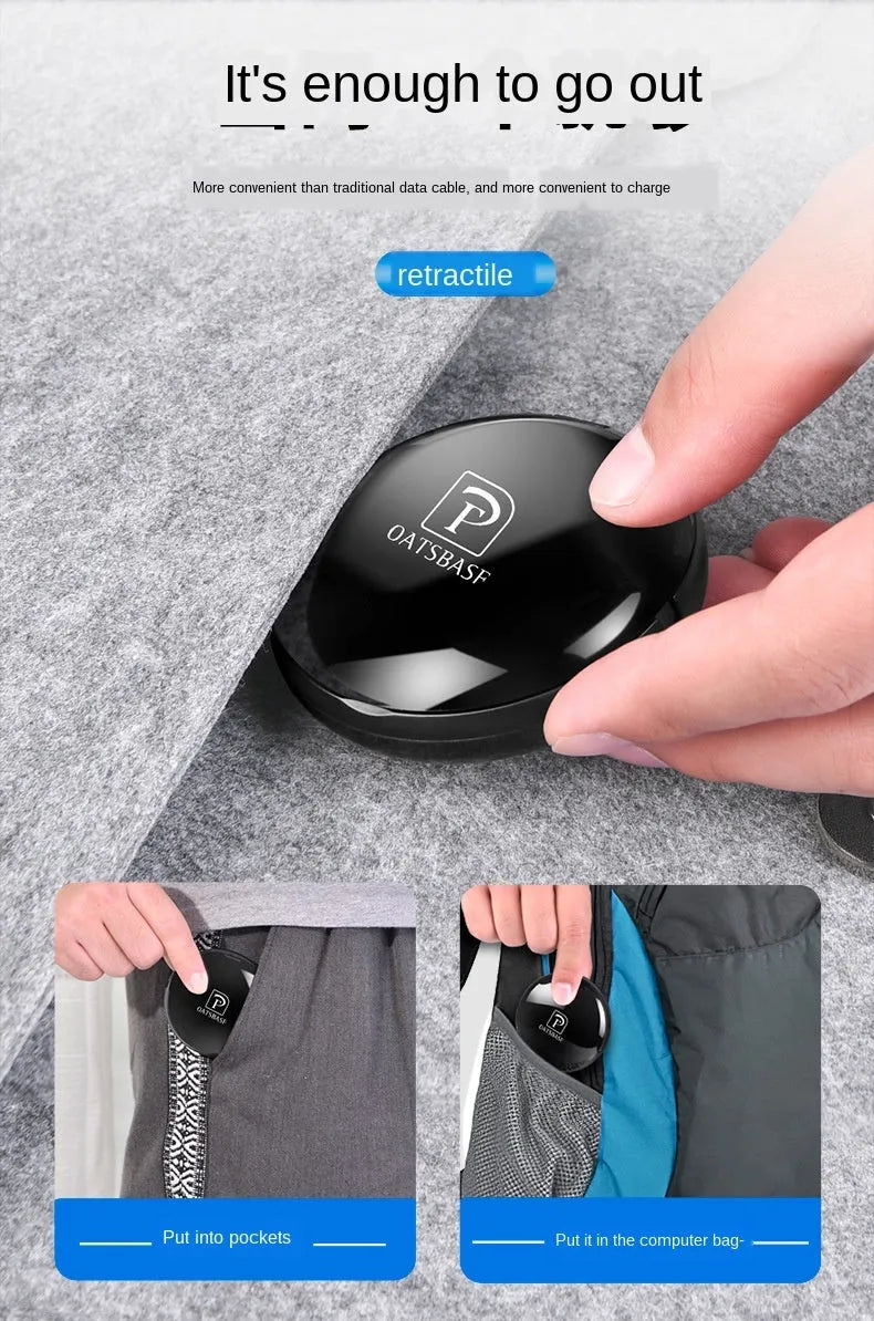 Magnetic Sucker 3-in-1 data cable in black with three connectors on a desk