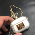White silicone perfume bottle style case for AirPods Pro and AirPods 3 charging box.
