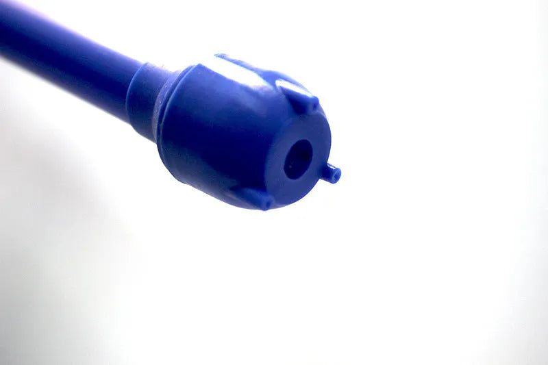 Blue and red manual hand siphon pump for fuel and liquid transfer