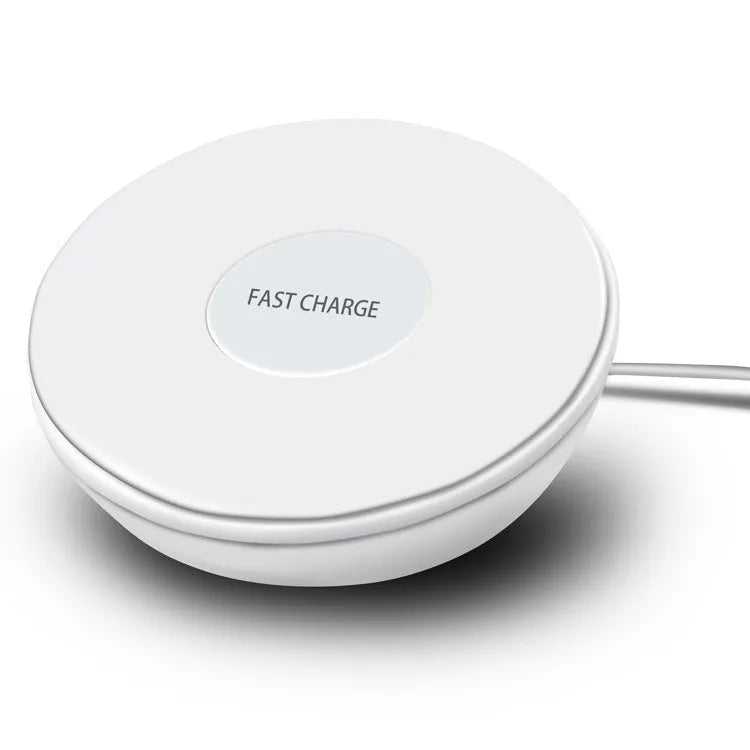 White wireless charging pad with digital clock display and night light, shown on a wooden surface.