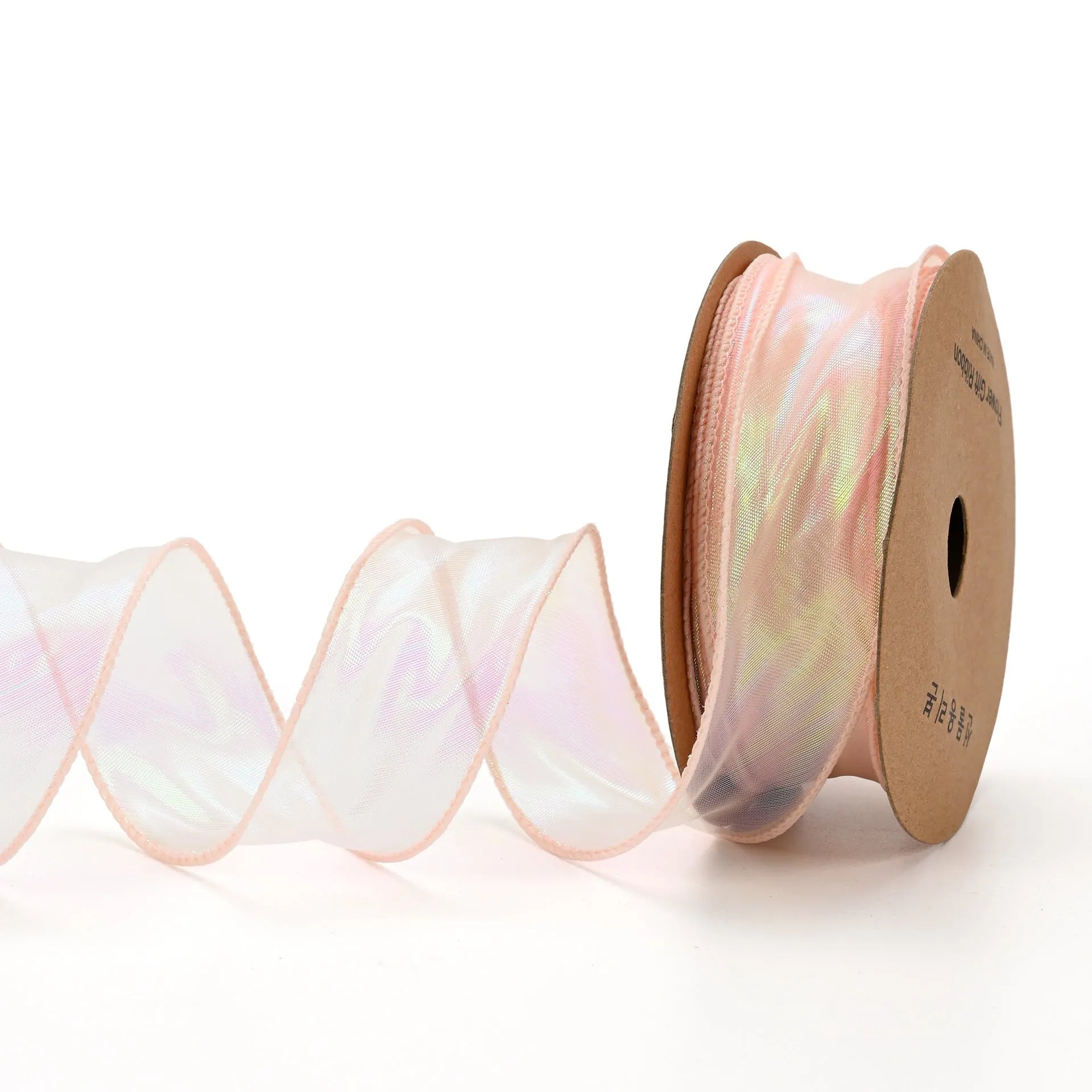 Roll of colourful fishtail yarn wave ribbon in mesh material, showing its textured, wave-like design.