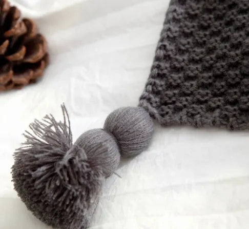 Nordic-style fringed knit acrylic blanket in beige, measuring 130 by 170 centimetres.