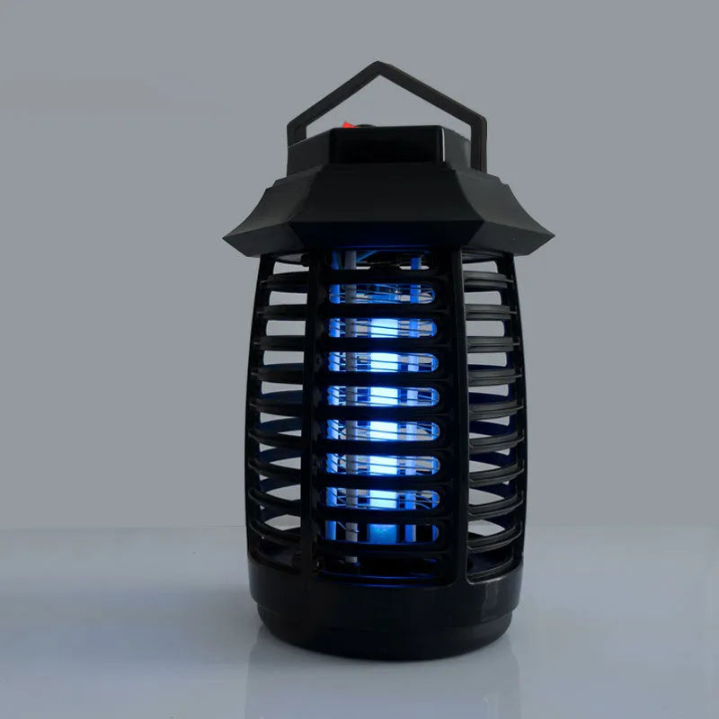 Black aromatherapy mosquito lamp with a UV light tube and metal grid for indoor insect control.
