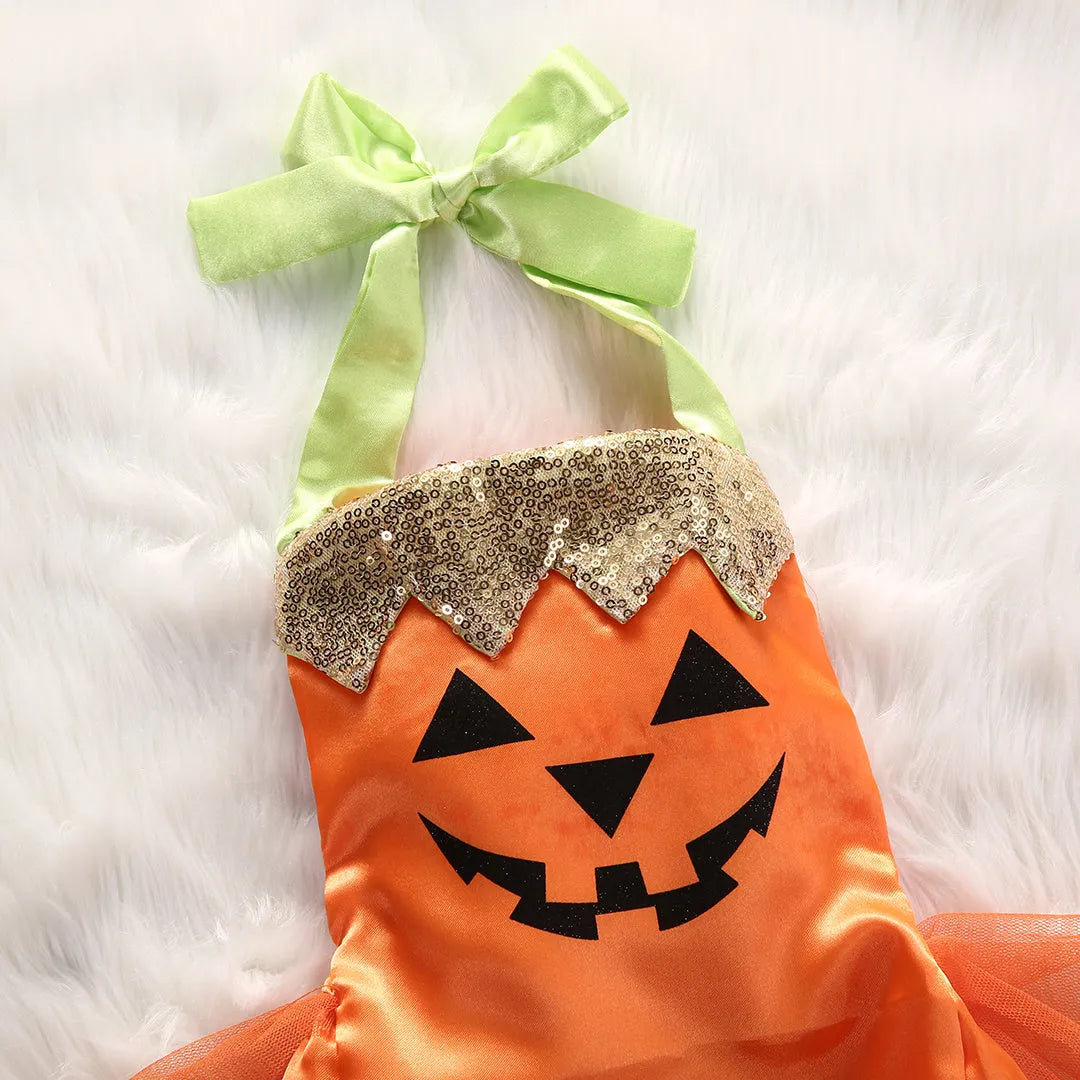 Children's orange Halloween gauze jumpsuit with cartoon dot pattern and voluminous pleated skirt on a white background
