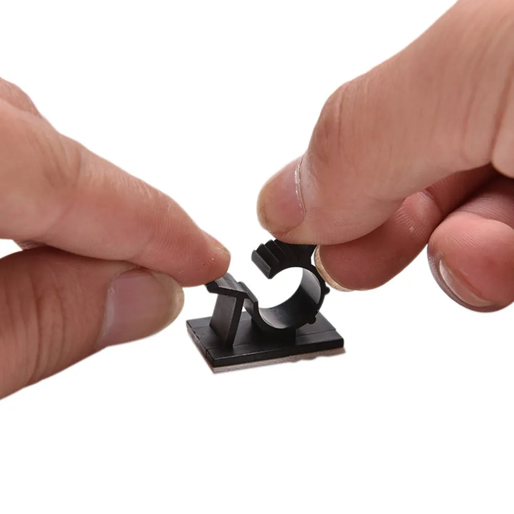 Black nylon adhesive cable clamps showing two-stage lock design for 13mm maximum cable diameter