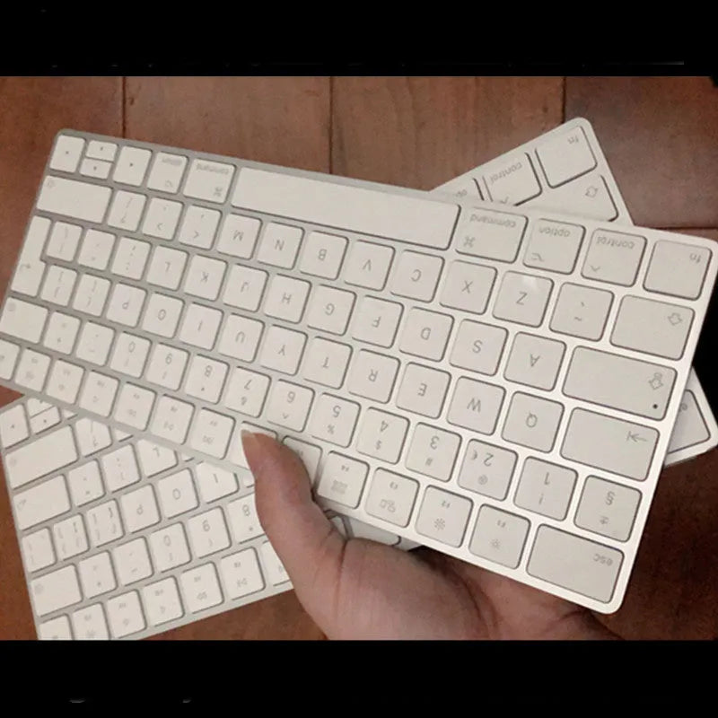 Apple white metal Bluetooth wireless keyboard with ultra-thin design and multimedia function keys