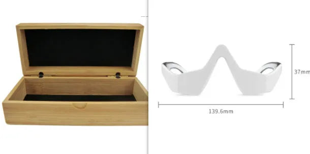 Pink and white 3D micro-current eye massager shaped like glasses on a grey background.