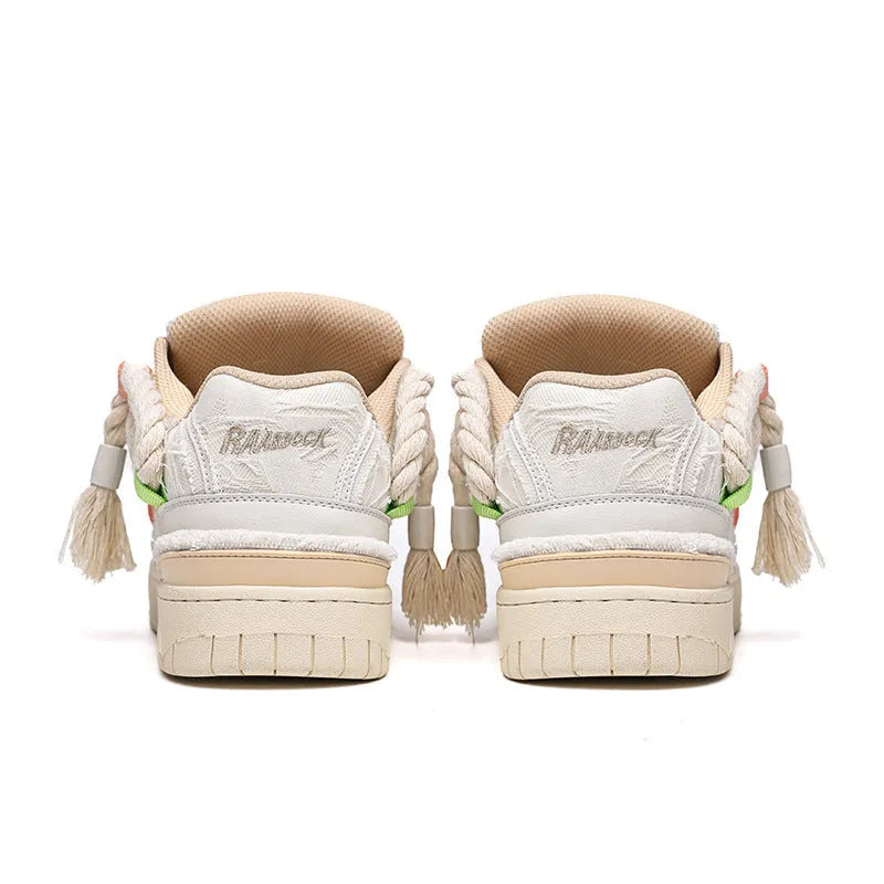 Creamy white Old Damage retro skate shoes with lace-up front and platform sole.