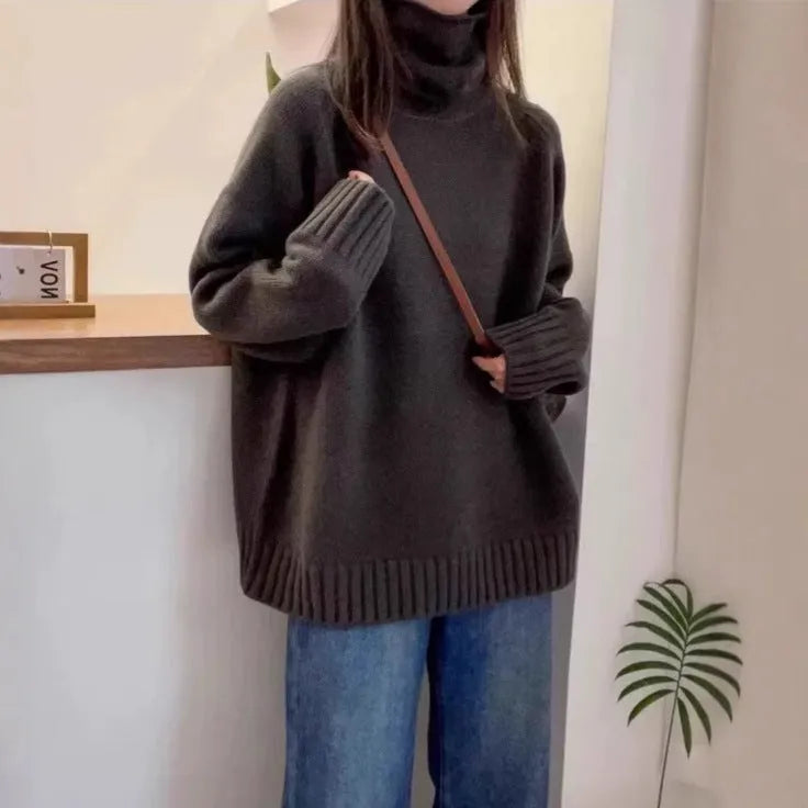 Loose red women's turtleneck sweater with thick curling collar, casual idle style.