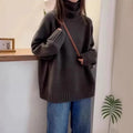 Loose red women's turtleneck sweater with thick curling collar, casual idle style.