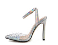 Women's pointed toe stiletto sandals with a diamond detail on a glossy PVC upper.