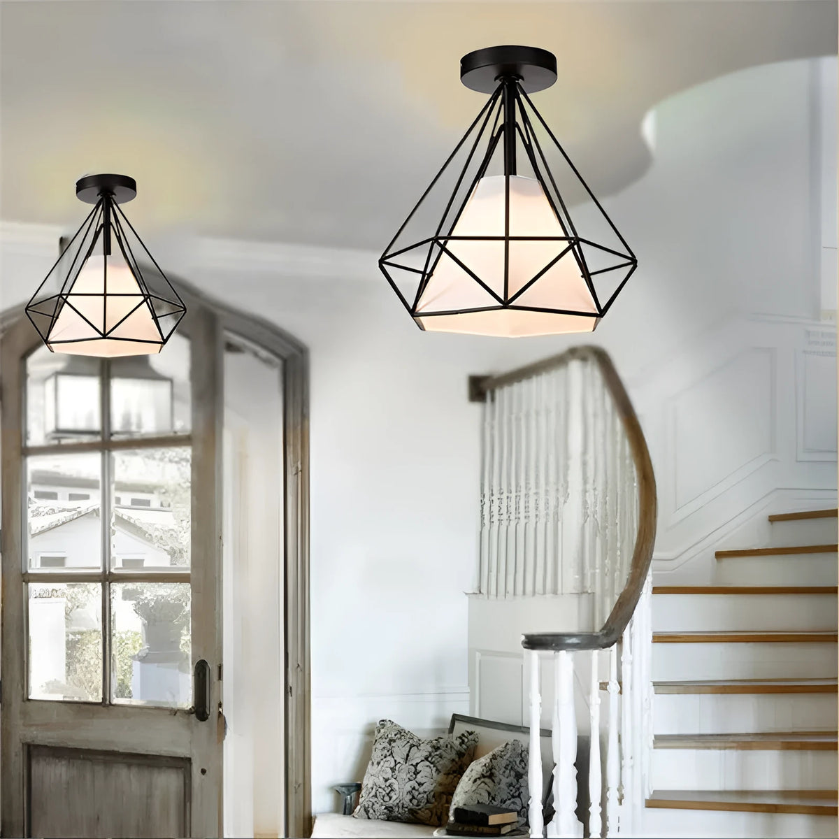 Black ceiling lamp with 10cm diameter plate and 1 metre adjustable drop on white ceiling