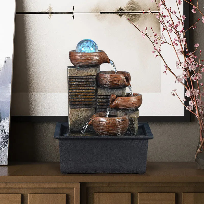 European desktop fountain with crystal ball and flowing water on a wooden desk