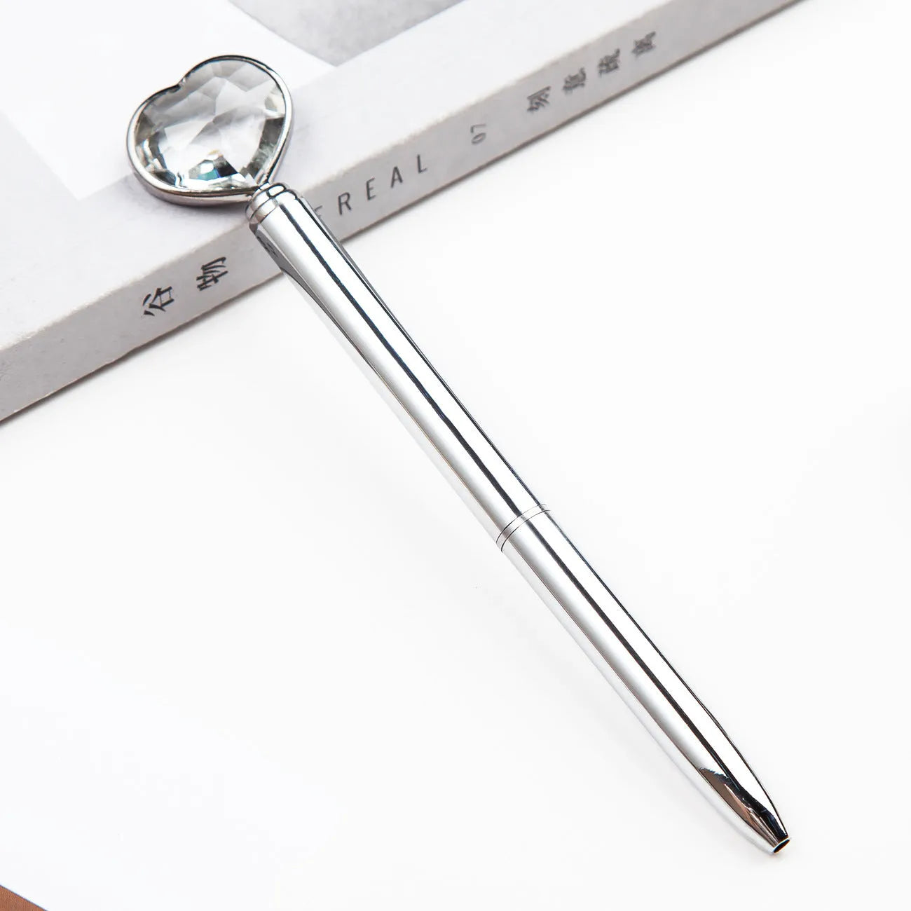 Creative Crystal Love Ball Diamond Metal Pen in golden, rose gold, and silver finishes showing decorative pattern