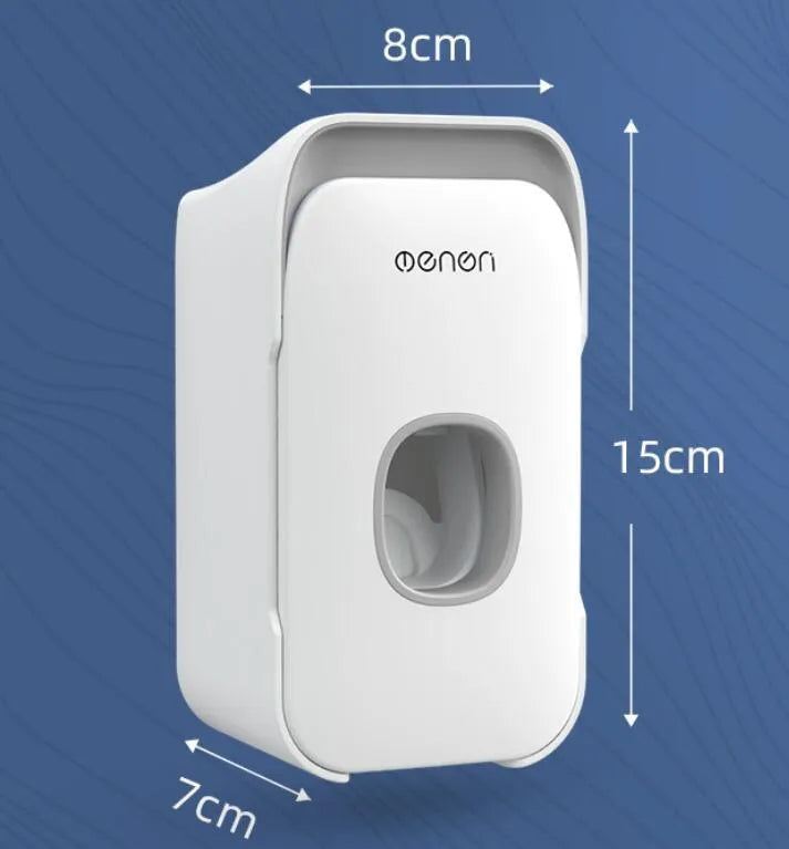 Blue automatic toothpaste dispenser mounted on a bathroom wall with a push-button for one-handed use.