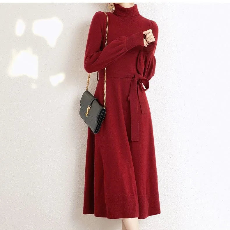 Rose red turtleneck knitted polyester dress with long sleeves, elastic waist, and a loose mid-length skirt hem.