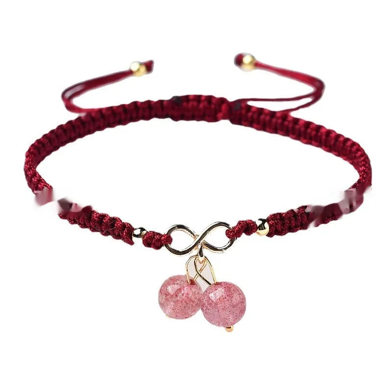 Women's Natural Strawberry Quartz bracelet with fruit-shaped cherry beads on a wrist.