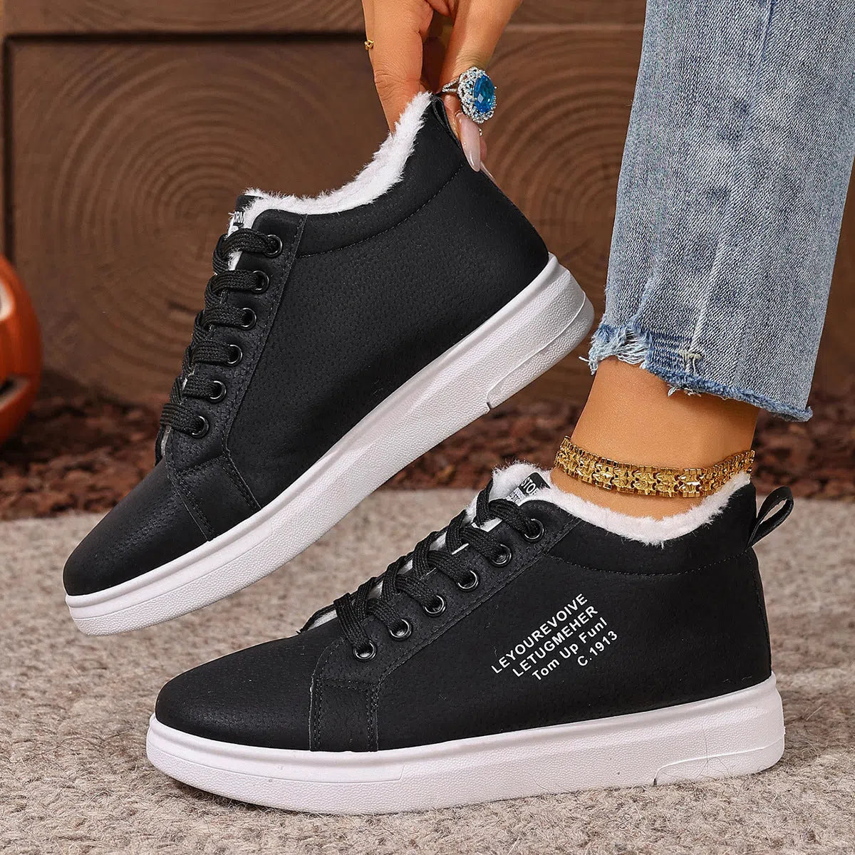 Women's flat sneakers with round toe and front lacing in black, brown, white, and pink