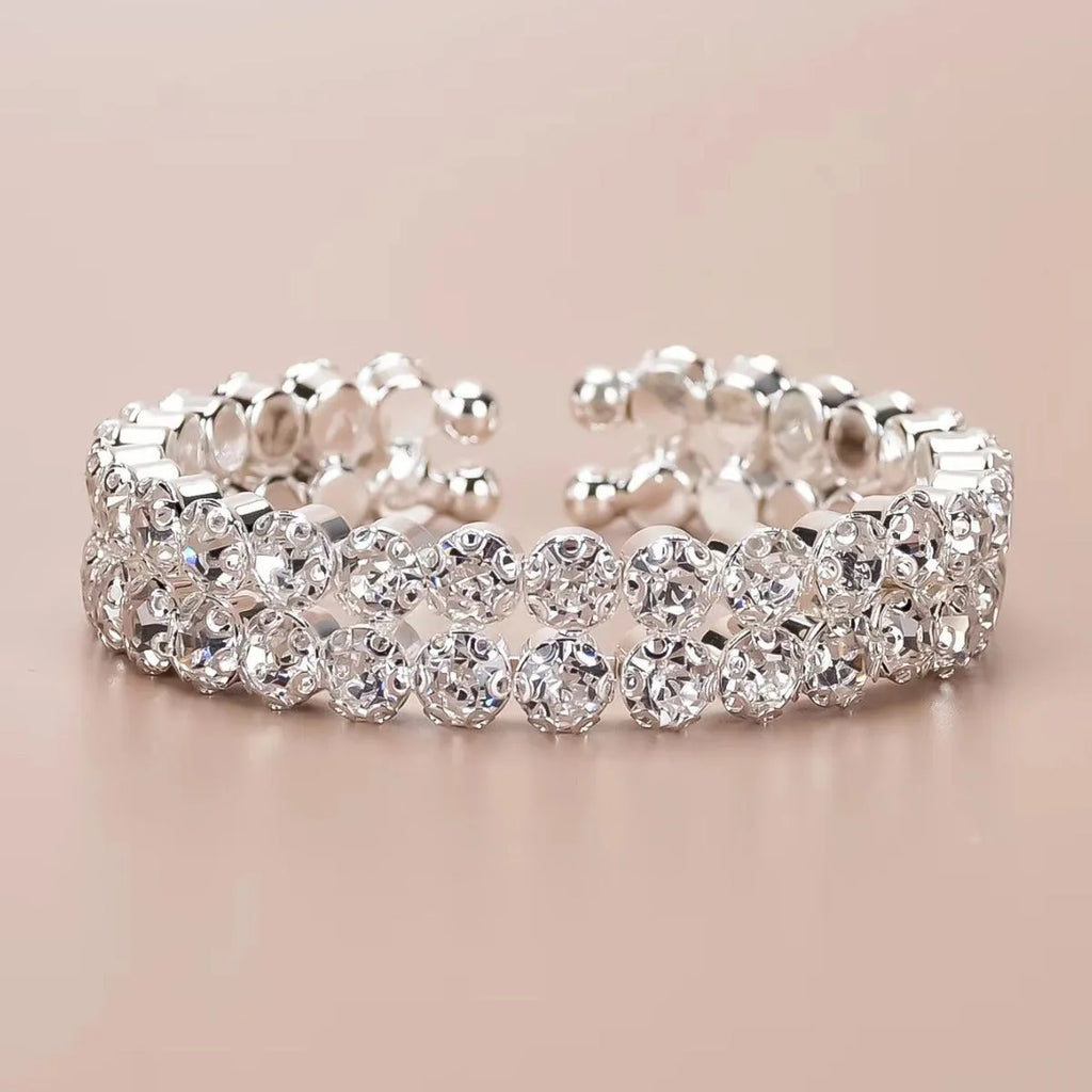 Silver elastic bracelet with double row of large rhinestones and wide opening design