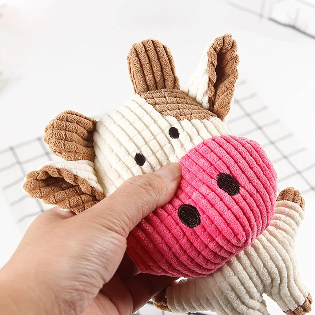 Animal shaped plush squeaky dog chew toy in assorted colours including blue, brown, and cow print.