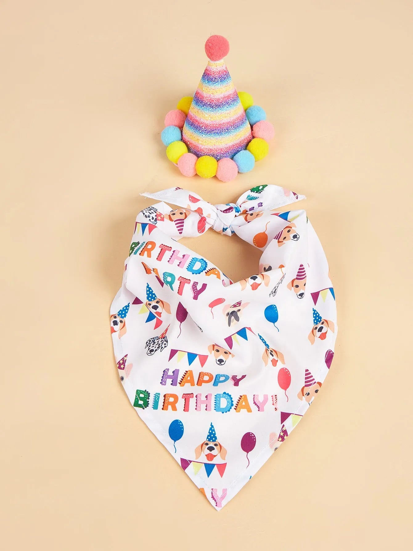 Printed polyester dog birthday hat and drool towel set in cartoon style with blue and pink colour options.